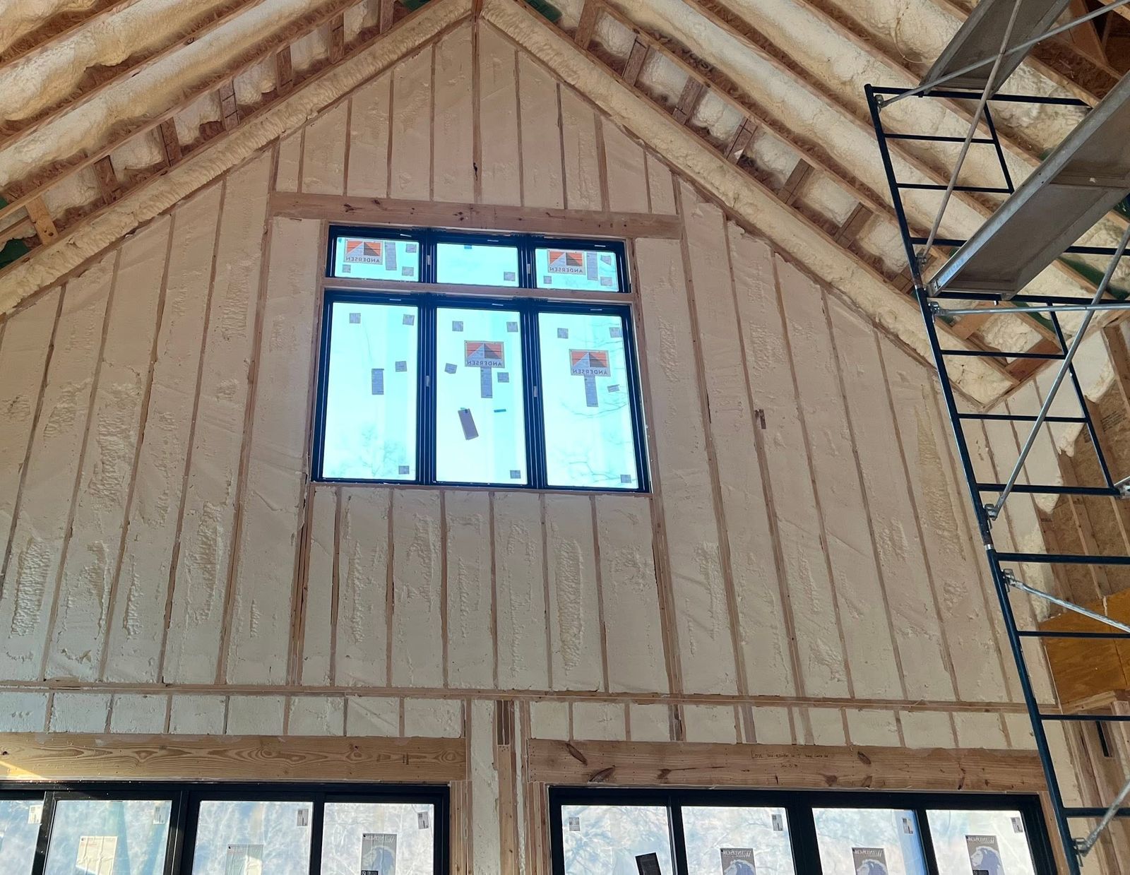 Gable wall with windows fully insulated with spray foam